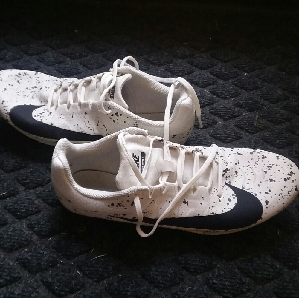 pair of white and black nike zoom rivals 10.5size